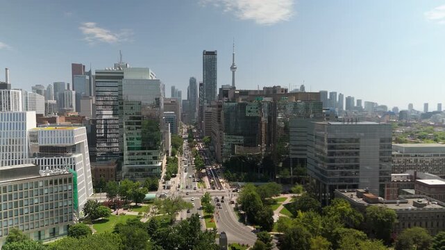 TORONTO, ONTARIO - JUNE 12 2024: Drone view of University Avenue corridor toward CN Tower