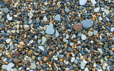 Natural texture of small coastal pebbles