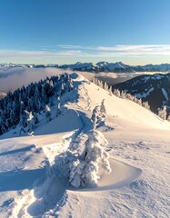 Snowy Mountain Ridge with Distant Peaks and Cloud Inversion.