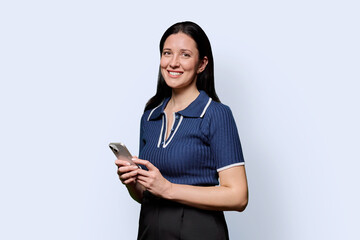 Portrait of successful middle-aged woman with smartphone on white background