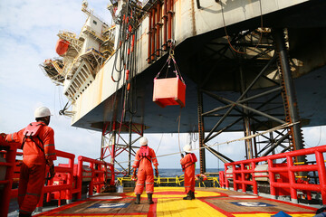 Crews boat moving the passenger and cargo from the platform to supply boat in oil and gas industry. Support offshore oil and gas industry by boat and service team.