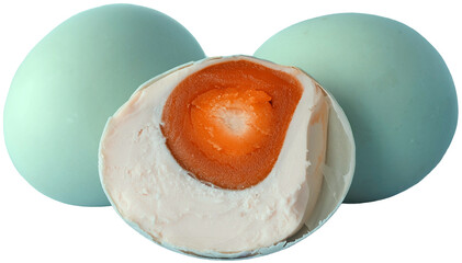 Composition of Salted Duck Eggs with One Halved Egg Exposing Orange Yolk in Center on Transparent Background