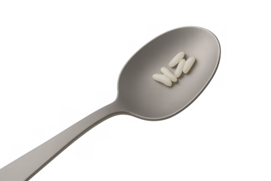 Spoon holding few rice grains symbolizing scarcity, hunger, and global food crisis on transparent background - Powered by Adobe