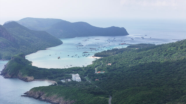 Tropical beaches, turquoise waters, and lush island landscapes of Con Dao, Vietnam. Aerial coastal scenery showcasing untouched nature and serene Southeast Asian beauty.