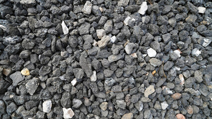 black stones background,Black basalt gravel used in landscaping and durable construction projects