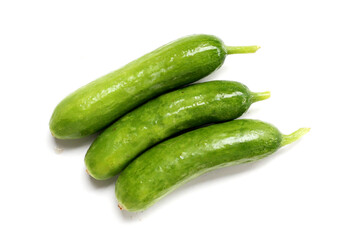 Fresh mini baby cucumbers on white background