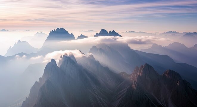 A breathtaking landscape featuring mountain peaks shrouded in mist and clouds, creating a serene and atmospheric scene. - Powered by Adobe