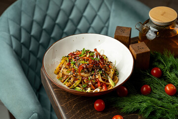 Brightly colored vegetable pasta is beautifully arranged in a stylish bowl, set against a backdrop of an inviting restaurant atmosphere with fresh ingredients nearby