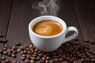 Fresh tasty espresso cup of hot coffee with coffee beans on dark background