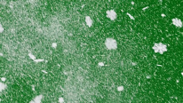 Abstract snowflake animation on green backdrop ideal for winter holiday designs