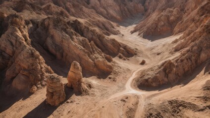 Dramatic Desert Landscape with Eroded Rock Formations and Winding Path.