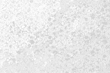 A grayscale abstract texture resembling a porous material or speckled pattern