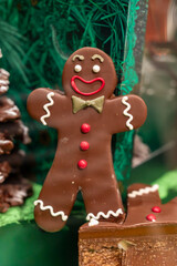 Fototapeta premium Christmas cookies, decorated with icing and chocolate gingerbread man in confectionery shop in London, UK
