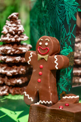 Christmas cookies, decorated with icing and chocolate gingerbread man in confectionery shop in London, UK