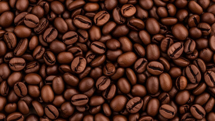 Obraz premium Close up macro view of roasted coffee beans showcasing their rich brown color and textured surface