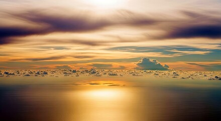 A beautiful view of the ocean and clouds at sunset with dramatic lighting.