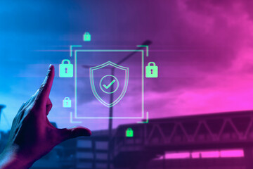 hand of businessman interactive touching a holographic anti-virus security shield system network and technology, success of innovation