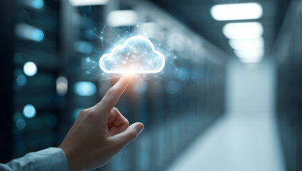 Human hand touching a luminous cloud technology icon, representing cloud computing and network connectivity in a data center