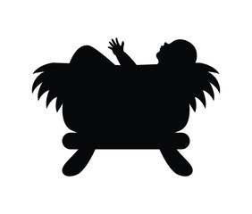 Silhouette of a baby  lying in a manger with hay on a white background in a minimalist style