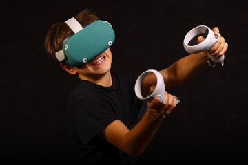 Focused boy intensely playing VR game with determined expression, fully immersed in virtual action and aiming for victory.