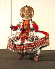 Classical kathakali dance performer in full costume and makeup from Kerala, India