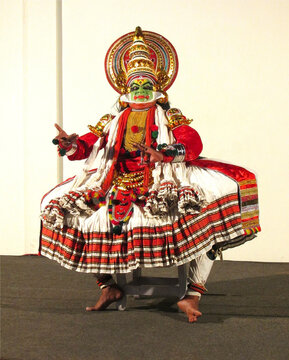Classical kathakali dance performer in full costume and makeup from Kerala, India