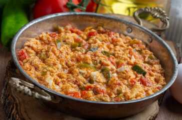 Turkish traditional menemen dish made with eggs, peppers and tomatoes