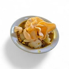 Savory Indonesian Dish with Yellow Sauce and Kerupuk