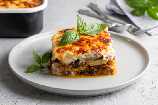 Traditional Greek potato and meat casserole with cheese - moussaka