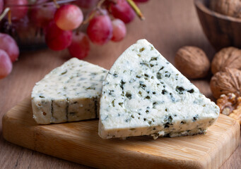 Sliced blue cheese - Roquefort cheese or gorgonzola cheese