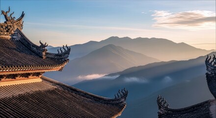 A traditional temple roof frames a stunning view of a mountain range at sunrise. The image captures the serene beauty of nature.