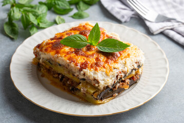 Traditional Greek potato and meat casserole with cheese - moussaka,