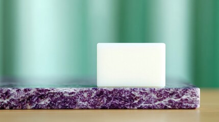 Soap Bar on Purple Stone Surface with Green Background