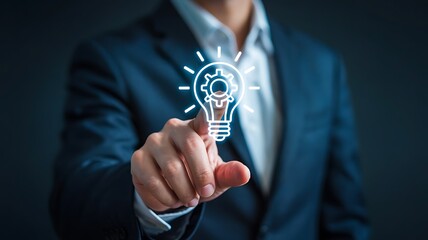 Businessman touching a glowing light bulb icon with gears inside symbolizing innovation and new business strategy development