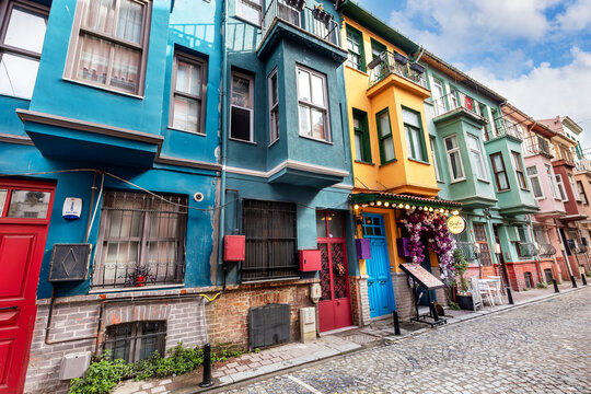Istanbul, Turkey, November 27, 2025: Colorful buildings in the Balat district of Istanbul attract attention with their vibrant hues. Shops and cafes invite people to explore this charming