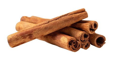 Several cinnamon sticks are piled together, isolated on black