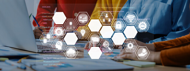 Professionals engage in innovative teamwork to enhance productivity, utilizing digital tools and interfaces for effective collaboration in a modern office environment. Trope