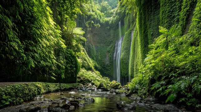 Lush green landscape featuring a waterfall surrounded by dense foliage, creating a serene and tranquil natural setting. - Powered by Adobe
