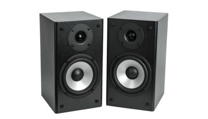 Pair of black rectangular speakers with silver cones, angled and isolated on black background