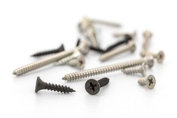 Collection of Various Screws Scattered on a Clean White Surface