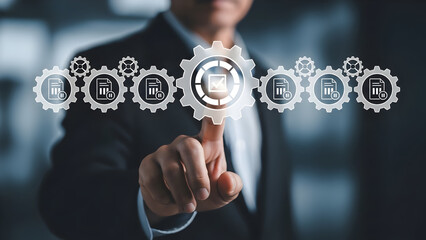 Businessman touching virtual gears symbolizing business process automation