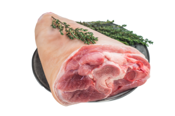 Uncooked pork shank hamhock showing skin texture fat layers and structural fibers arranged with fresh herbs for detailed technical food photography.