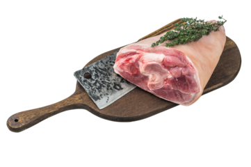 Uncooked pork shank knuckle on board with forged chopper and thyme great for butcher visuals kitchen tutorials and food photography projects.