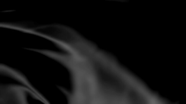 Black fabric waving in the wind animation isolated on black background