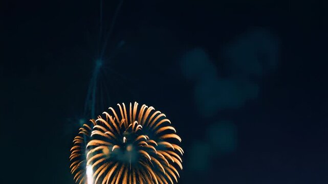 Video A large fireworks display lights up the night sky with vibrant colors and patterns