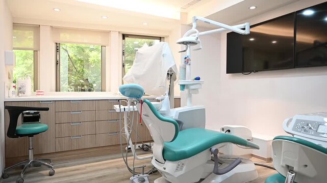 A modern dental operatory with a turquoise chair and surrounding equipment, shown with a near-to-far camera move