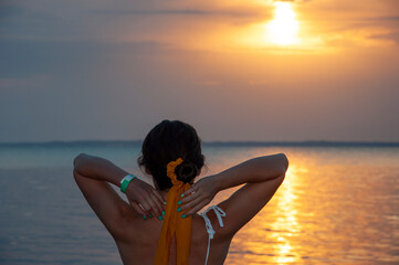 Girl at romantic sunset horizon. Silhouette girl sunrise. Romantic woman sunset sea beach in summer. Woman at sea sunrise. Sunset beach and sky with seascape. Summer sea beach sunrise. Orange skyline