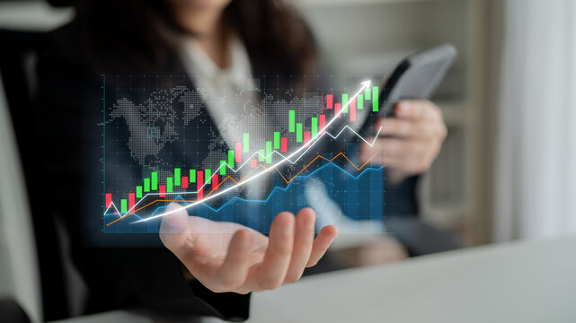 A business professional interacts with a smartphone, showcasing dynamic financial data visualizations that illustrate market growth and analytics in a modern office environment. Impute - Powered by Adobe