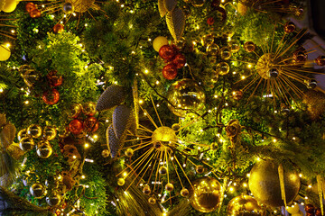 A fragment of Christmas and New Year decorations with balls and garlands, festive background. Soft focus, selective focus