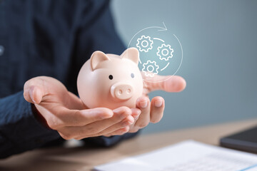 Hands holding a piggy bank with a digital workflow icon, symbolizing approved payments, successful transactions, and organized financial management. Payment approved message